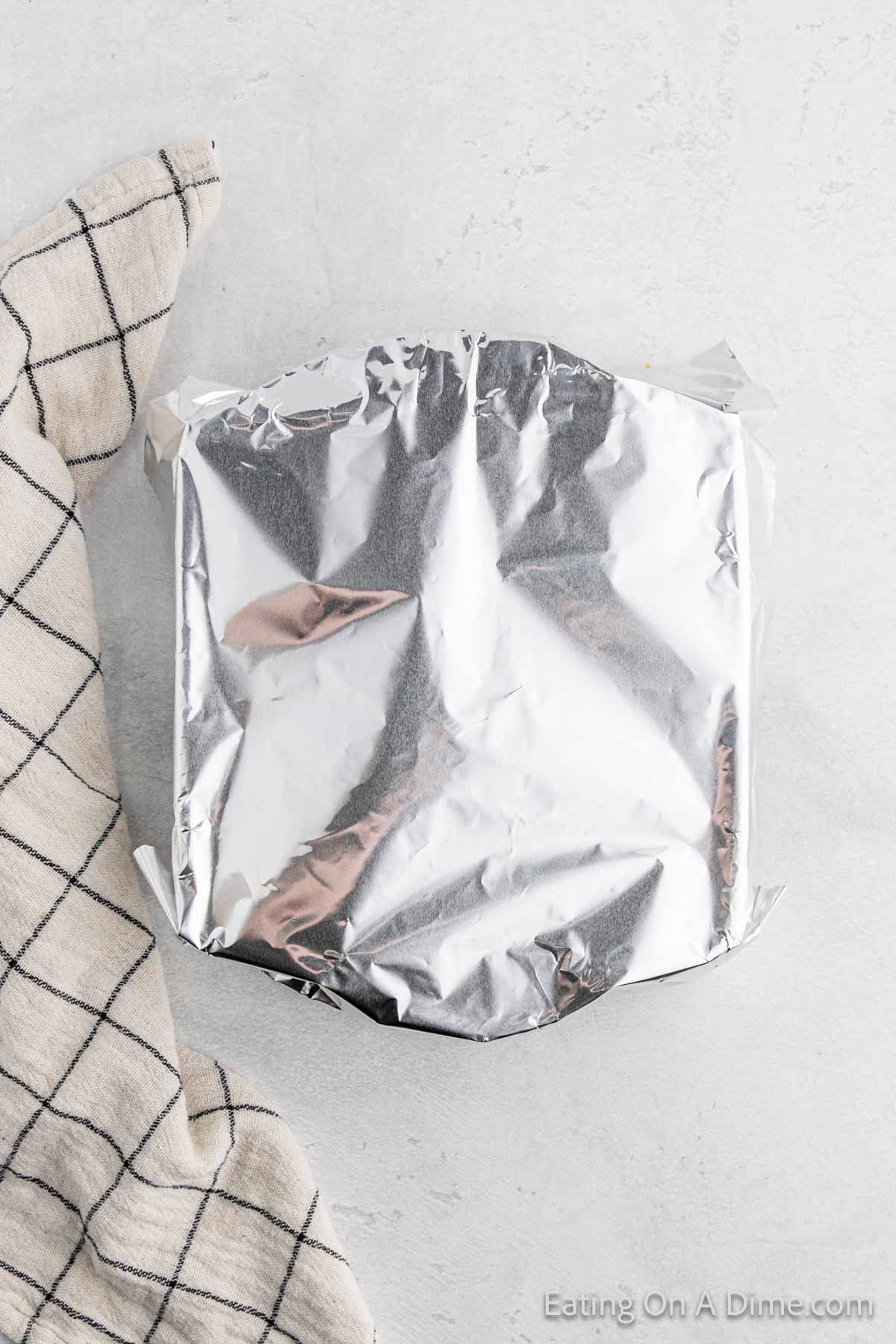 Casserole dish topped with aluminum foil