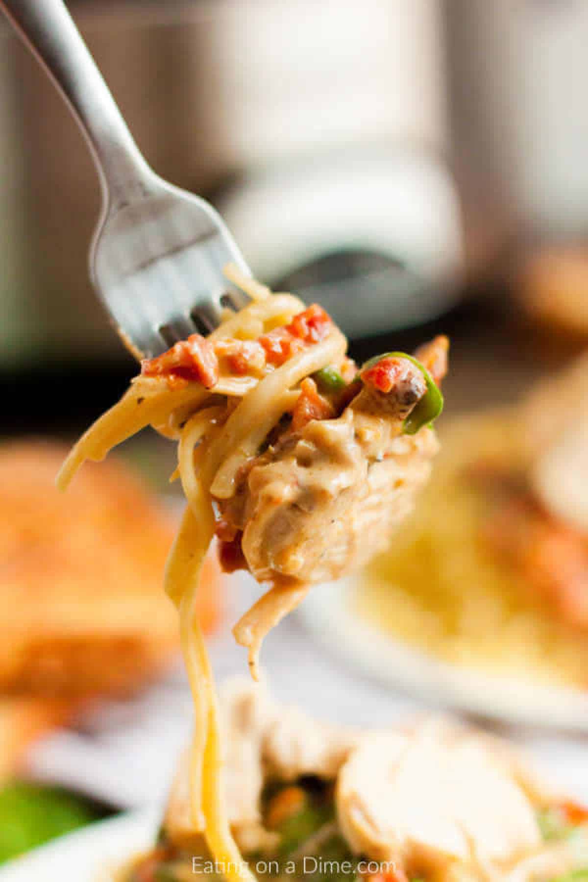 Close up image of a bite of Tuscan Chicken. 