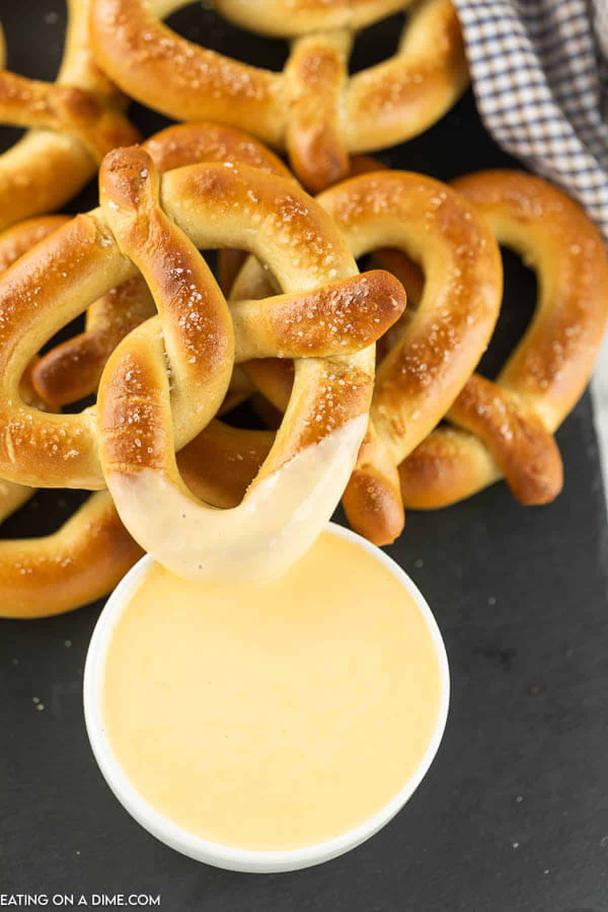 bowl of cheese sauce and pretzels