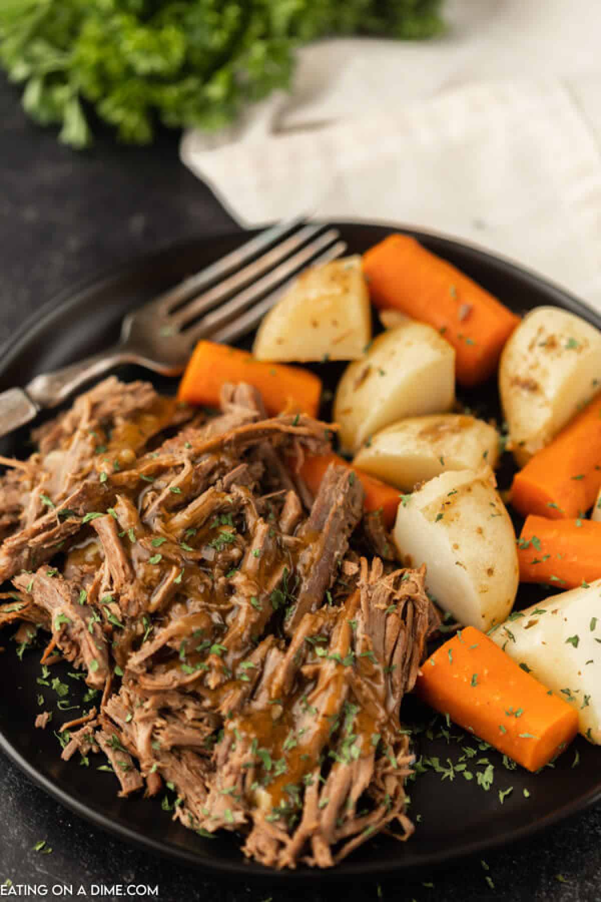 plate of roast, potatoes and carrots