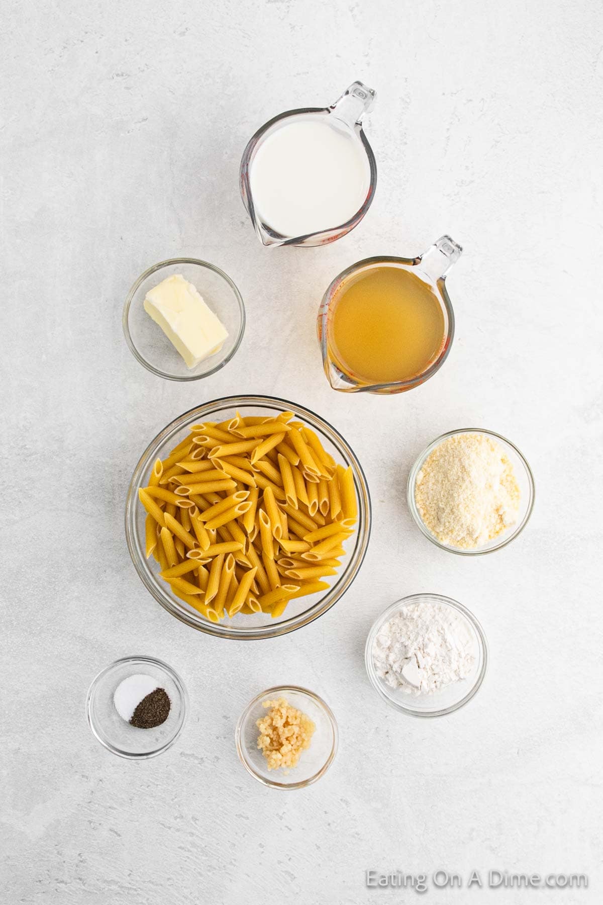 Ingredients - Penne Pasta, butter, flour, minced garlic, chicken broth, milk, parmesan cheese, salt, pepper