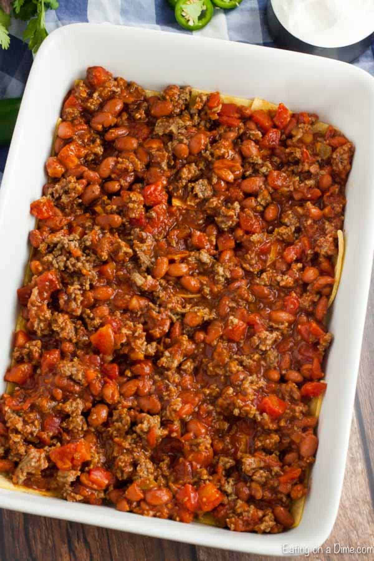 The meat mixture poured on top of the corn tortillas. 