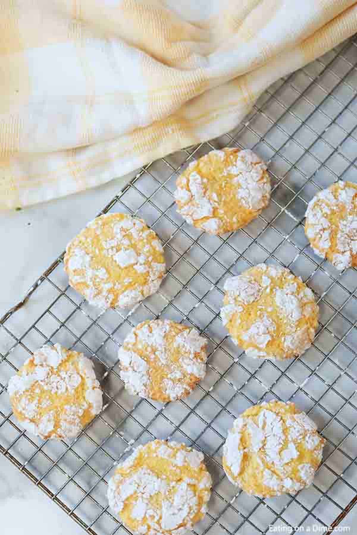 The cookies being placed on a cooling rack to cool completely. 