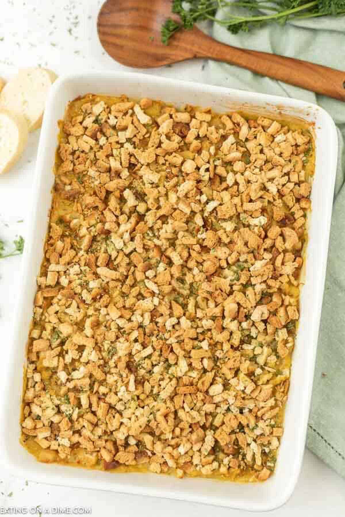 Chicken stuffing bake in white casserole dish. 