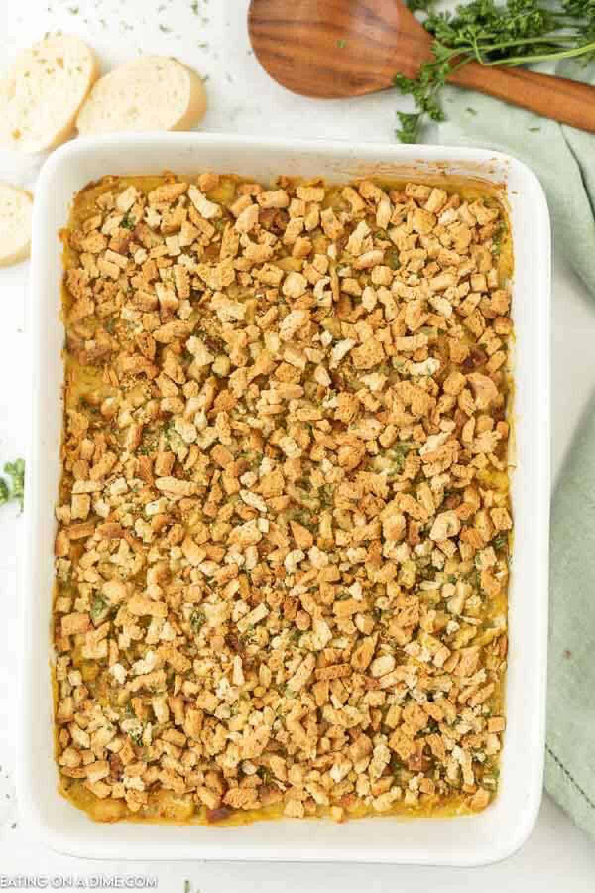 Chicken stuffing bake in white casserole dish. 