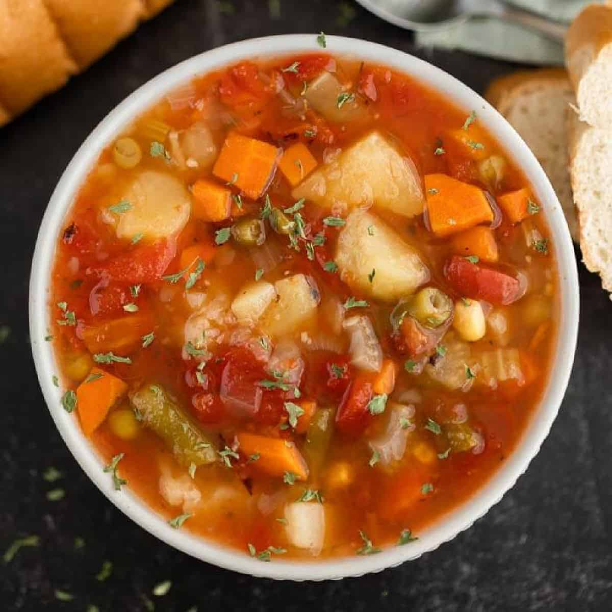 Close up image of vegetable soup in a crock pot. 