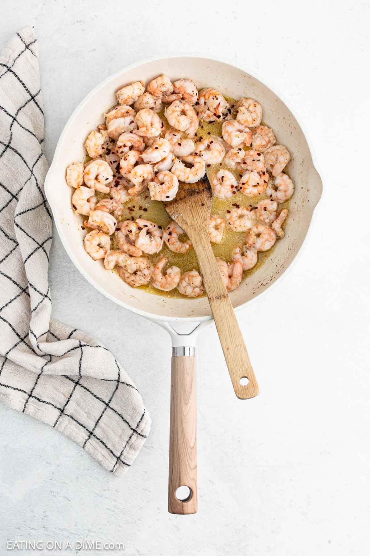 Cooked Shrimp in a skillet with melted butter