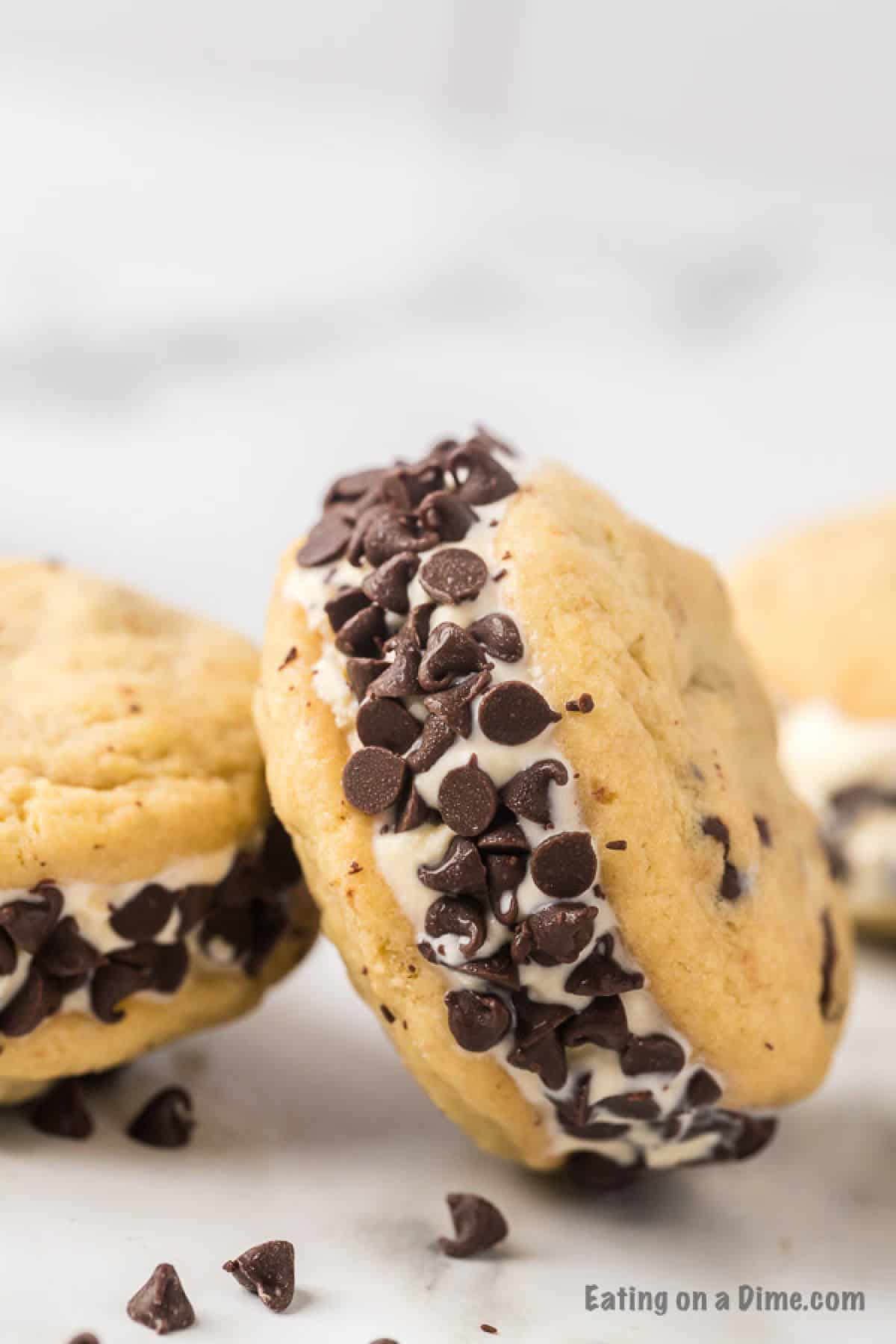 Close up image of two chocolate chip ice cream sandwiches. 