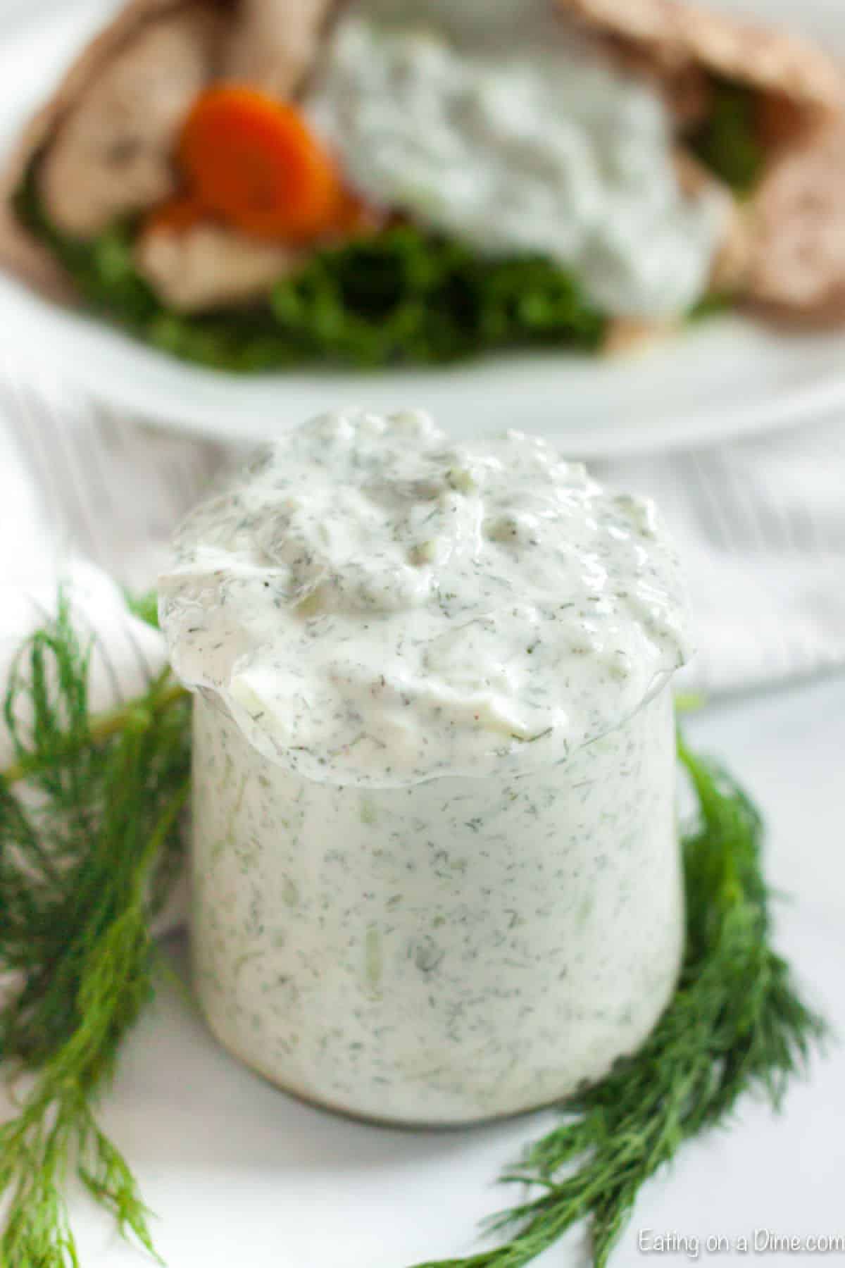 Close up image of a jar of Tzatziki Sauce
