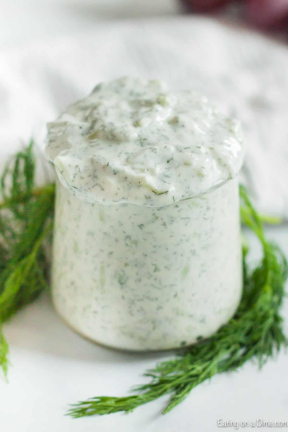 Close up image of a jar of Tzatziki Sauce