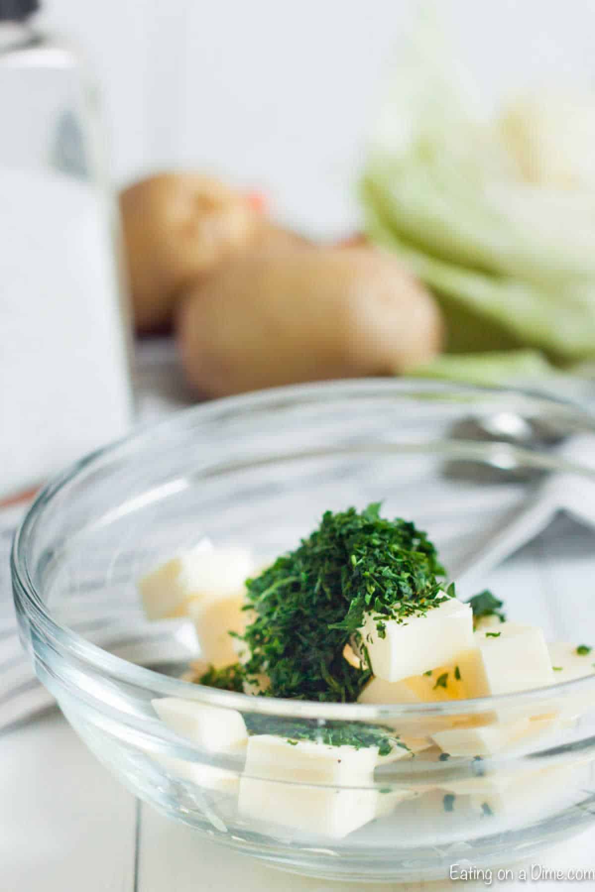 Slice butter in a bowl topped parsley