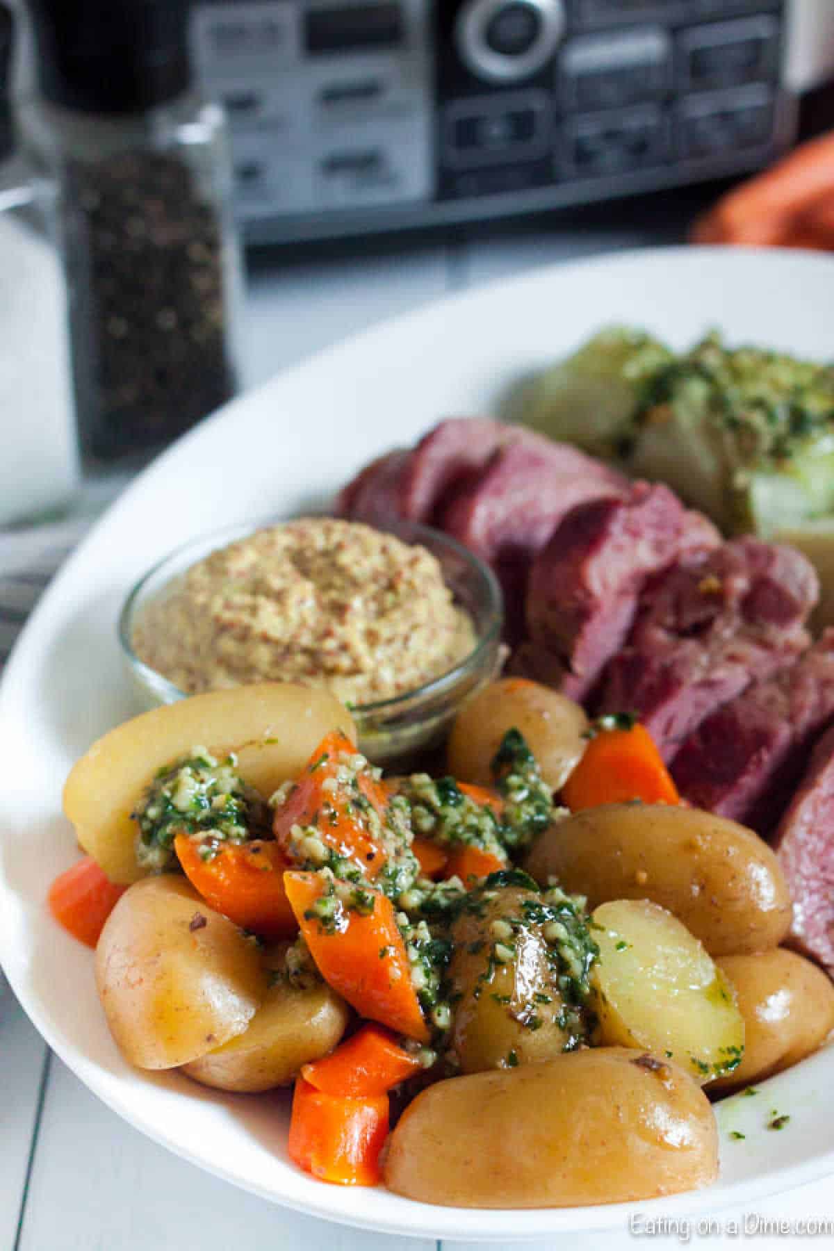 Roasted potatoes and carrots, sliced corned beef platter