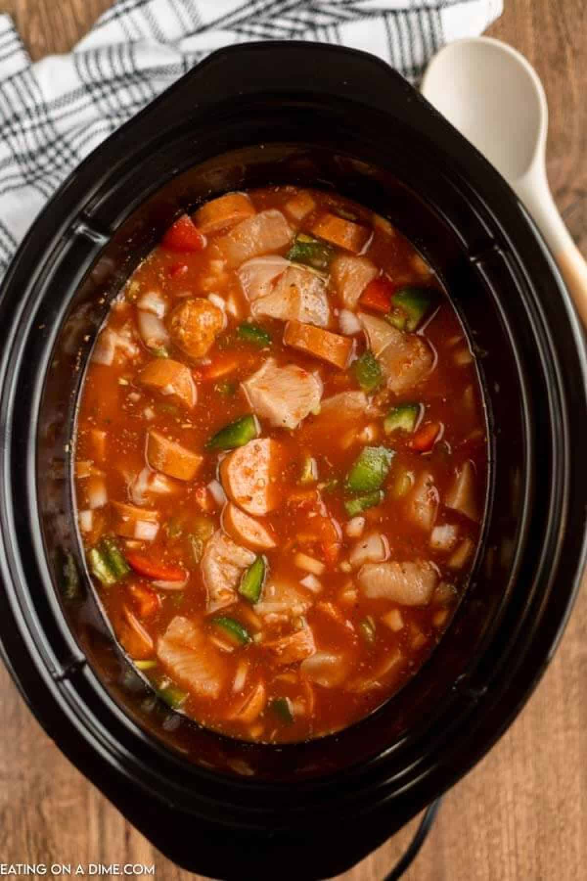 Uncooked chicken jambalaya in the crock pot. 