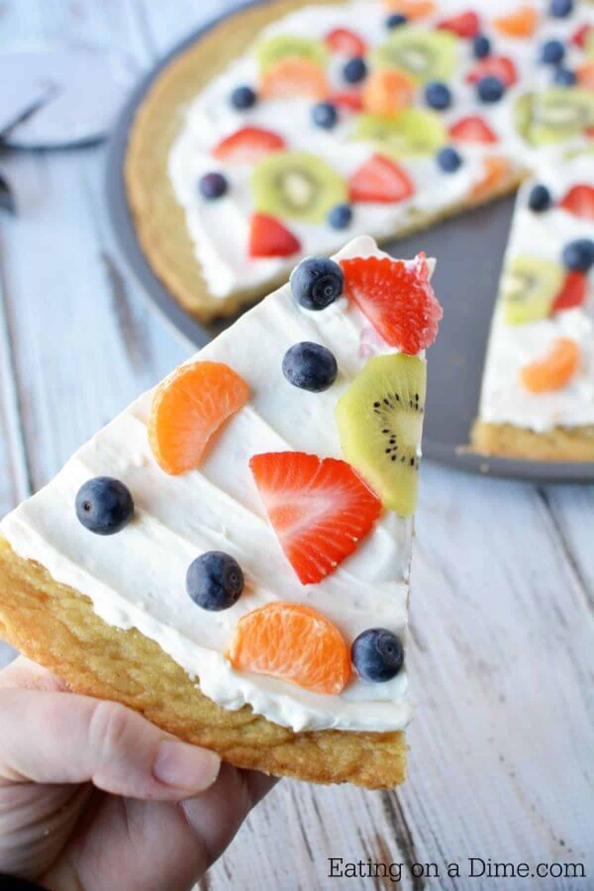 Close up image of a fruit pizza sliced. 