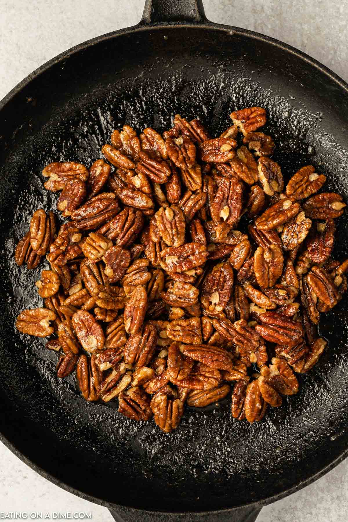 Candied Pecans in a cast iron skillet