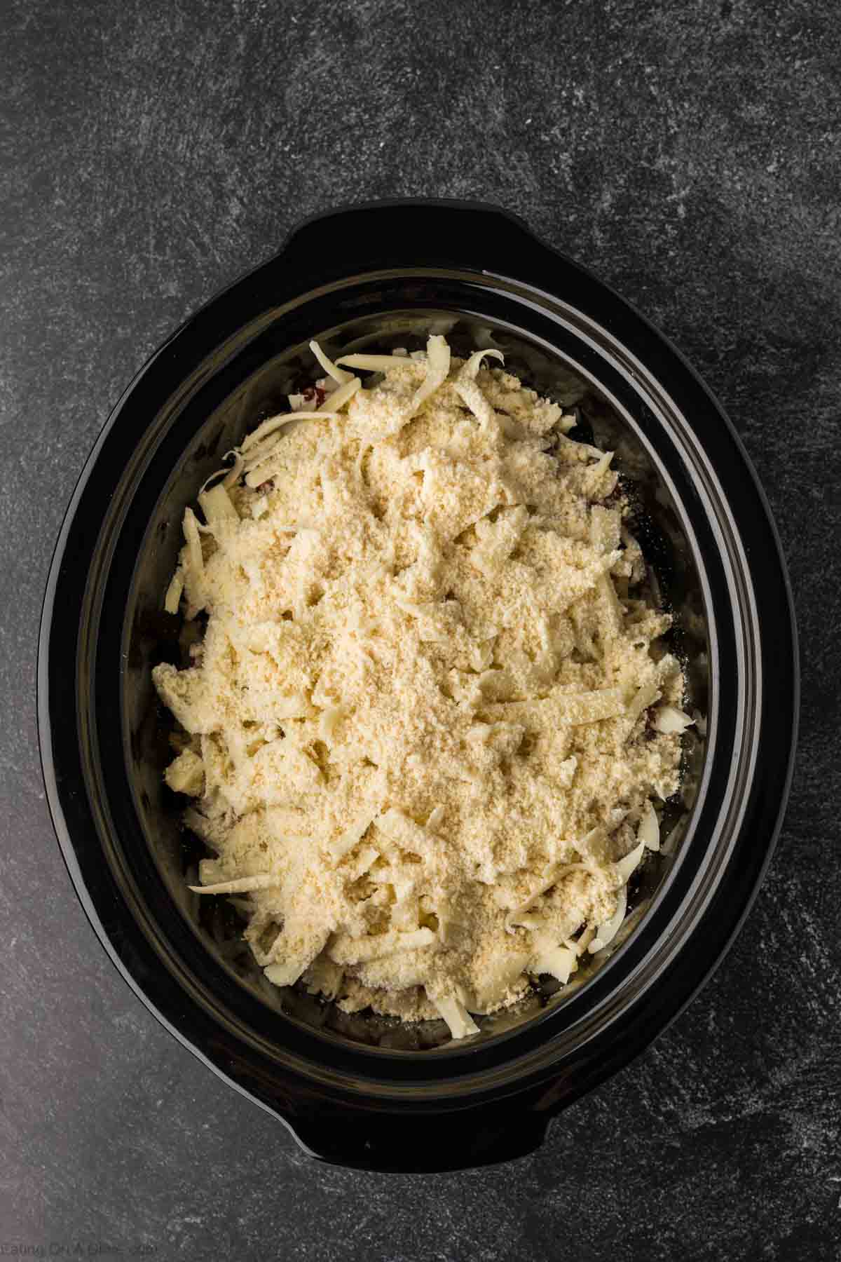 Shredded cheese mixture in the slow cooker