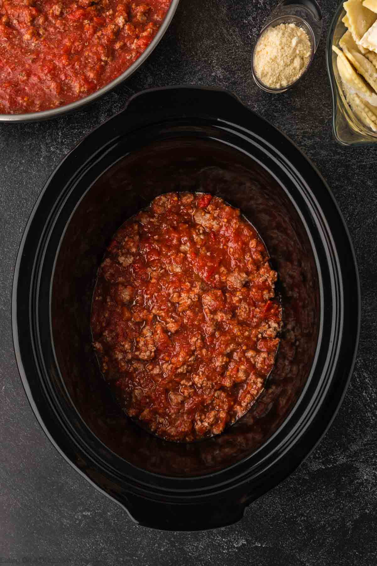 Layer of the Ground beef mixture in the slow cooker