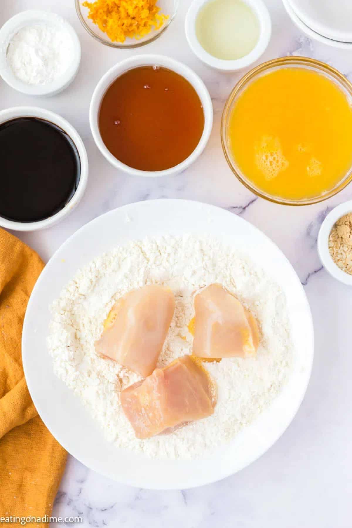 Ingredients needed - chicken, eggs, flour, cornstarch, oil, oranges, honey, soy sauce, rice wine vinegar, ginger, garlic