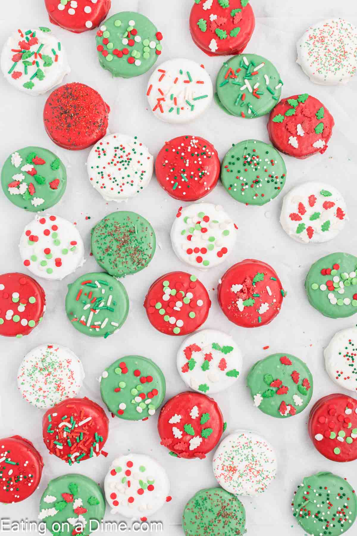 Red, Green, White Chocolate covered Oreos topped with sprinkles