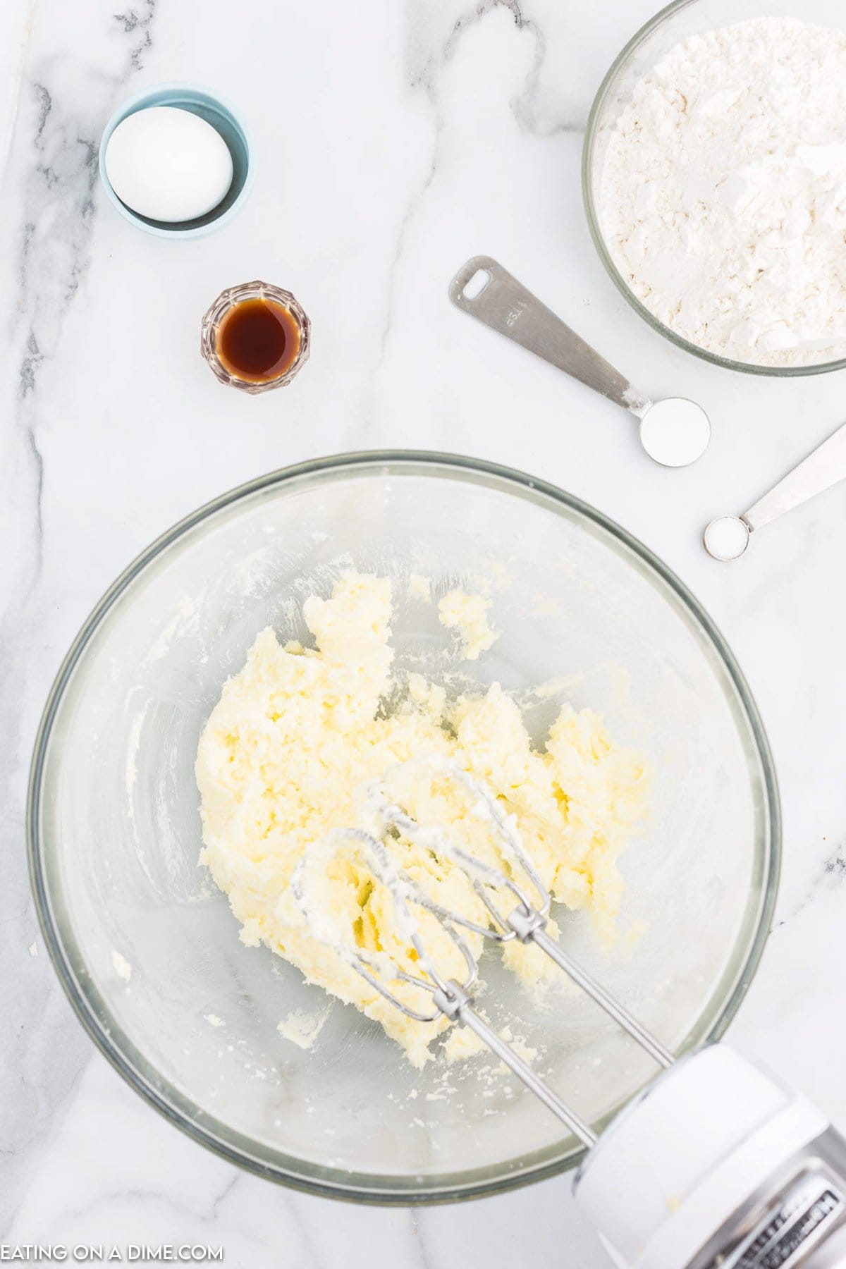 Cream together butter and sugar in a bowl with a hand mixer