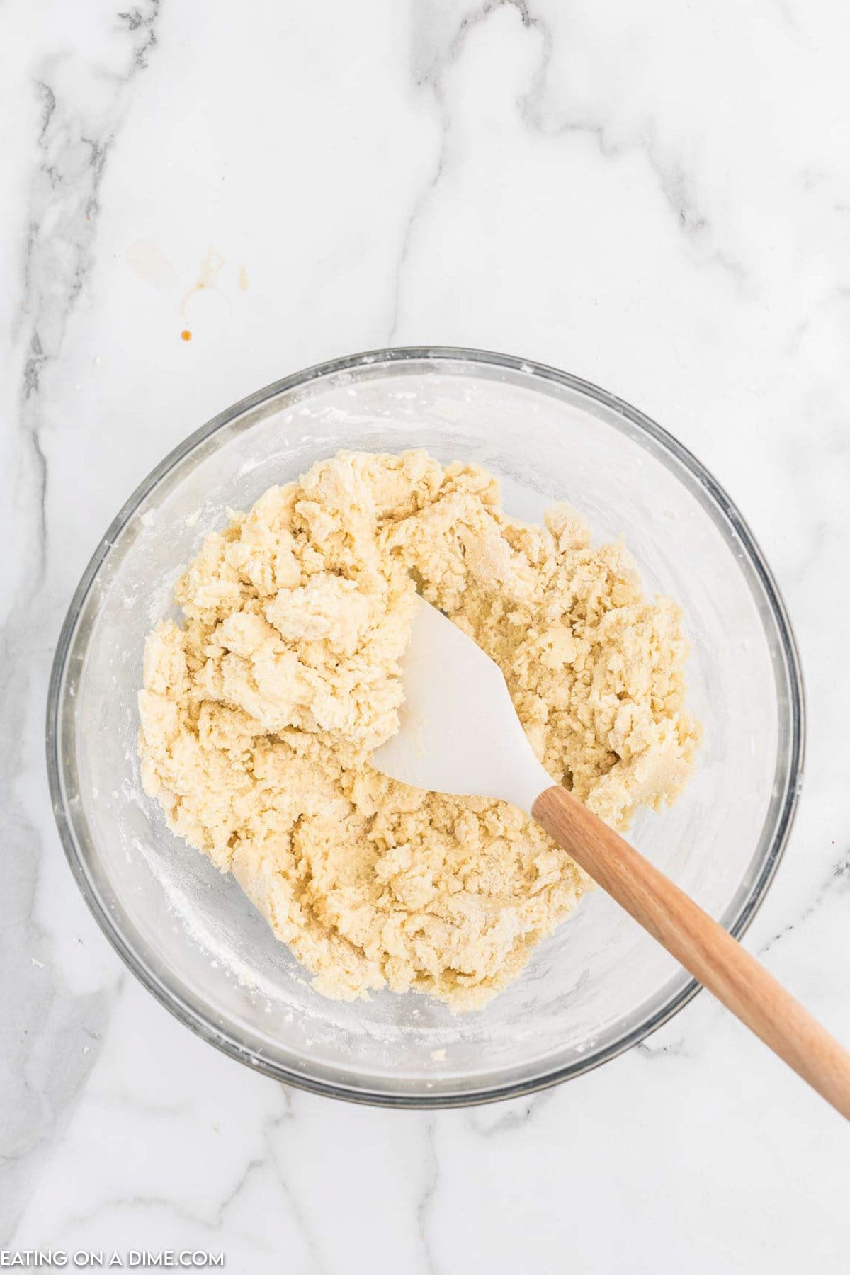 Add in the dry ingredients to the cream mixture in a bowl with a spatula. 