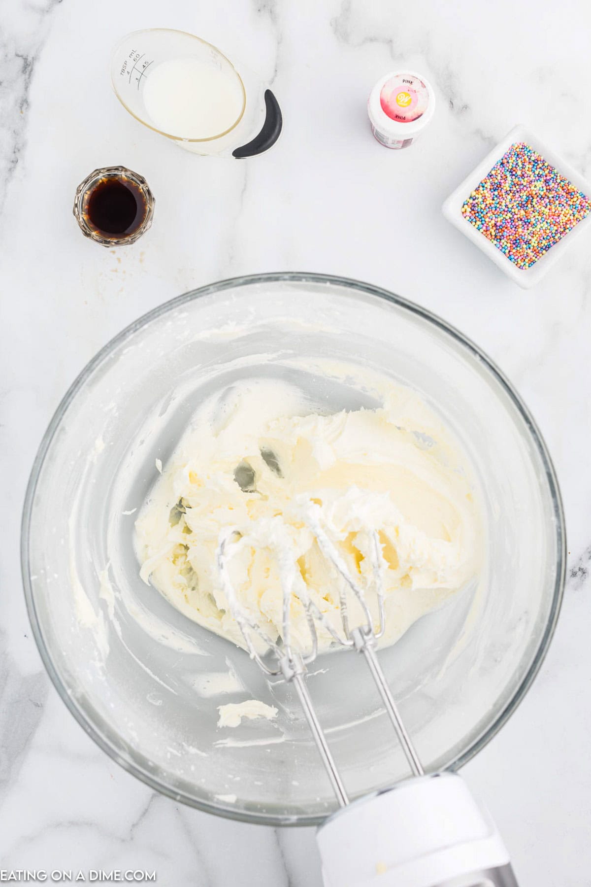 Cream together butter and powdered sugar in a bowl with a hand mixer