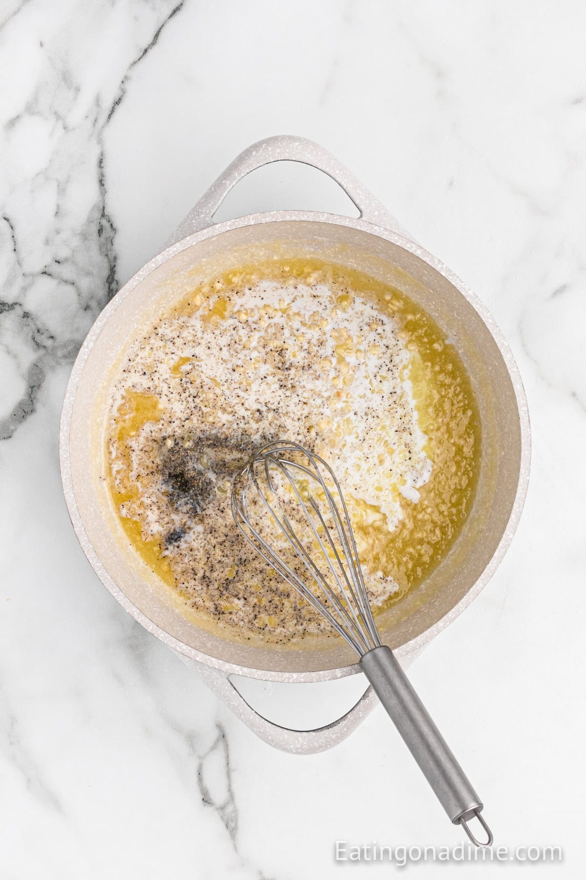 Melted butter in a large pot with milk, salt, pepper