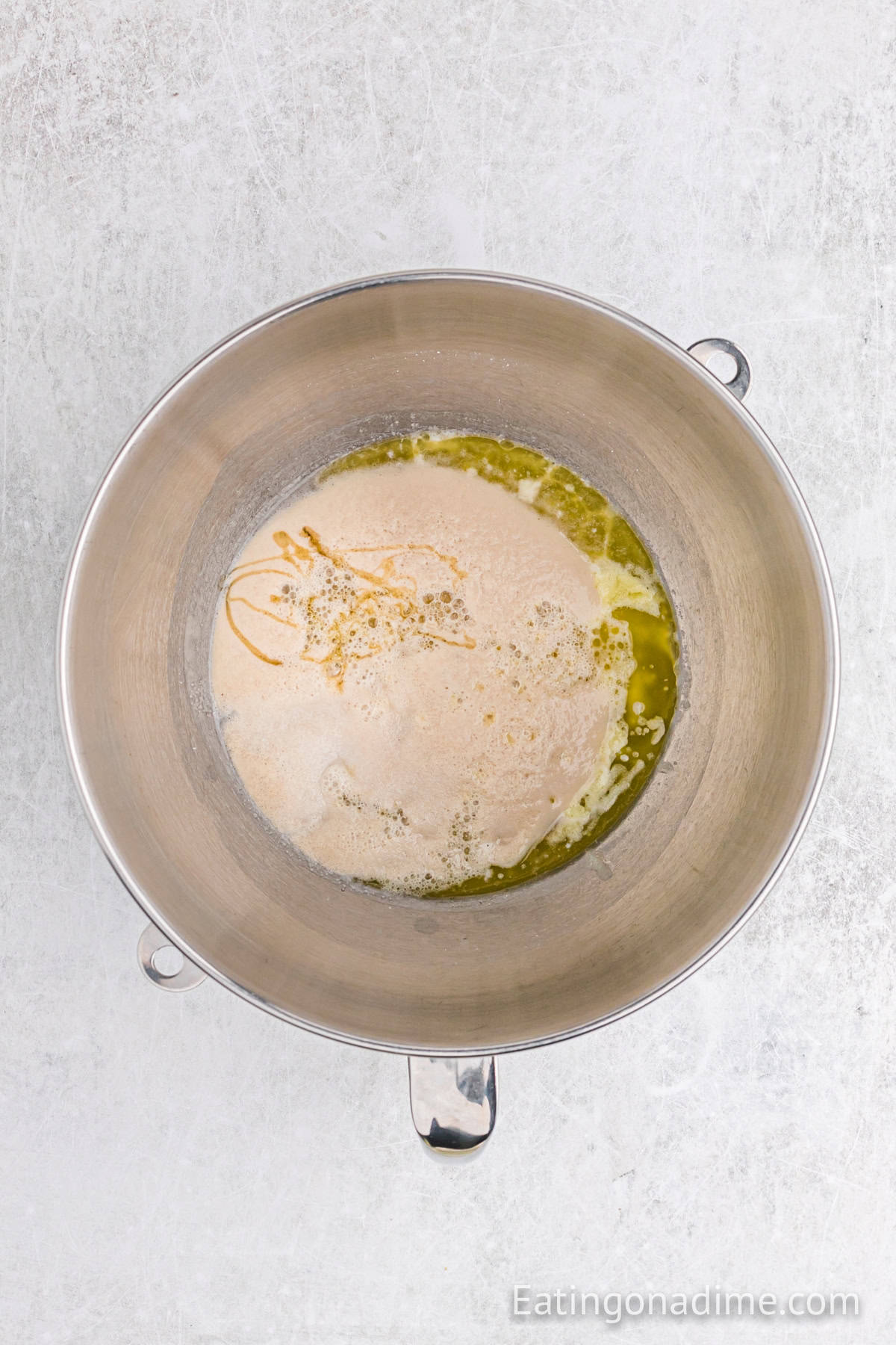 Melted, honey, salt with the yeast in a large mixing bowl