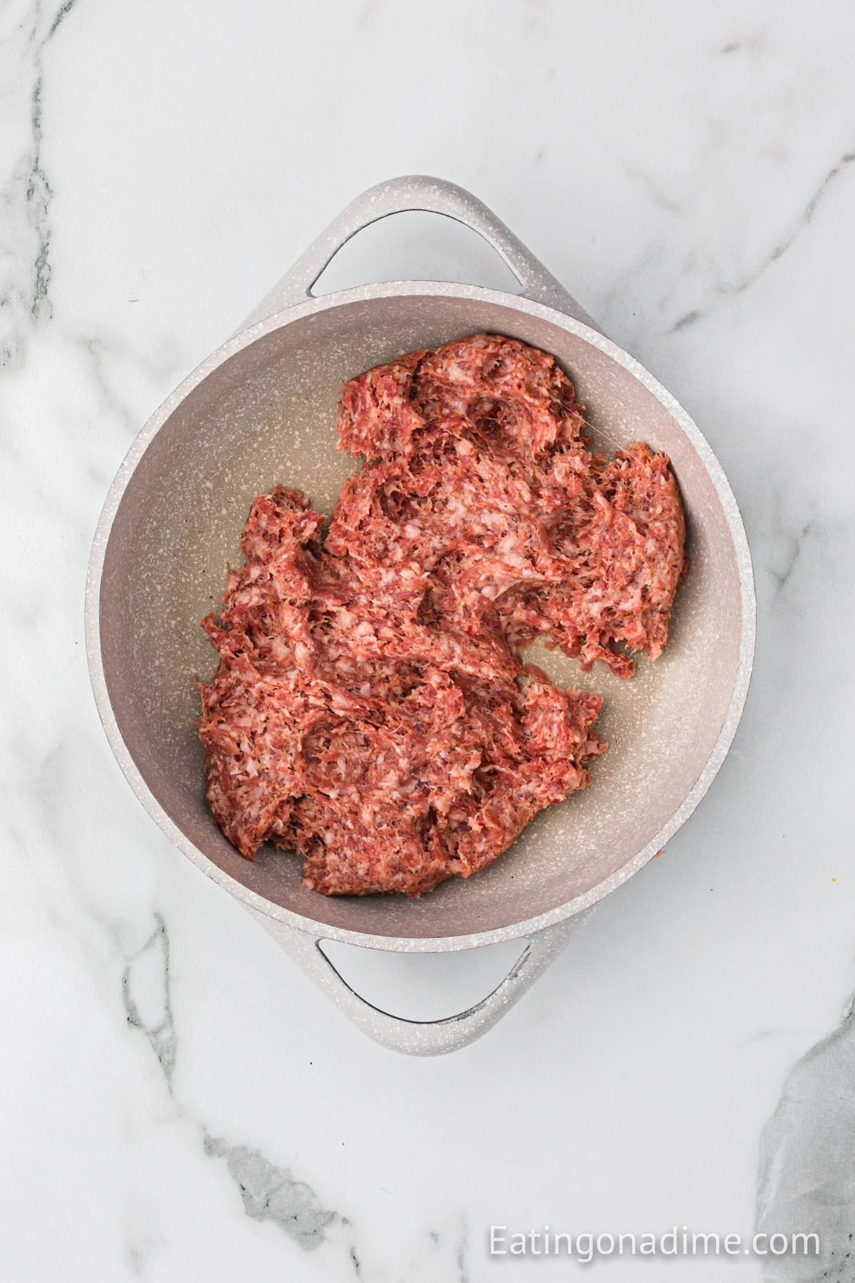 Cooking sausage in a large skillet