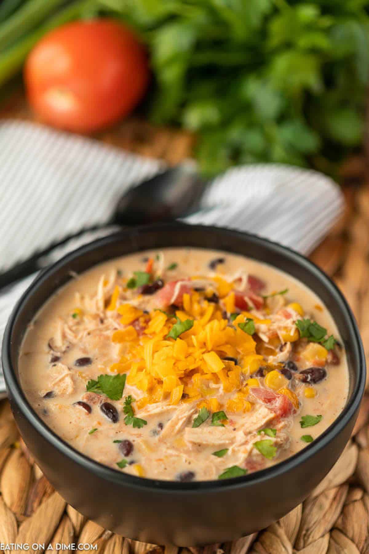 A black bowl of creamy chicken taco soup