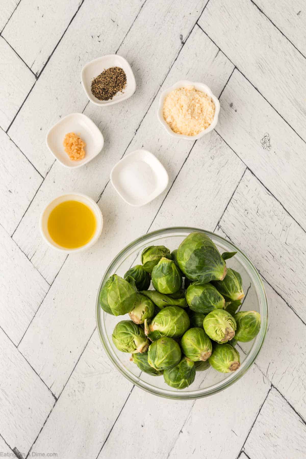 Ingredients - Brussel Sprouts, olive oil, minced garlic, salt, pepper, parmesan cheese