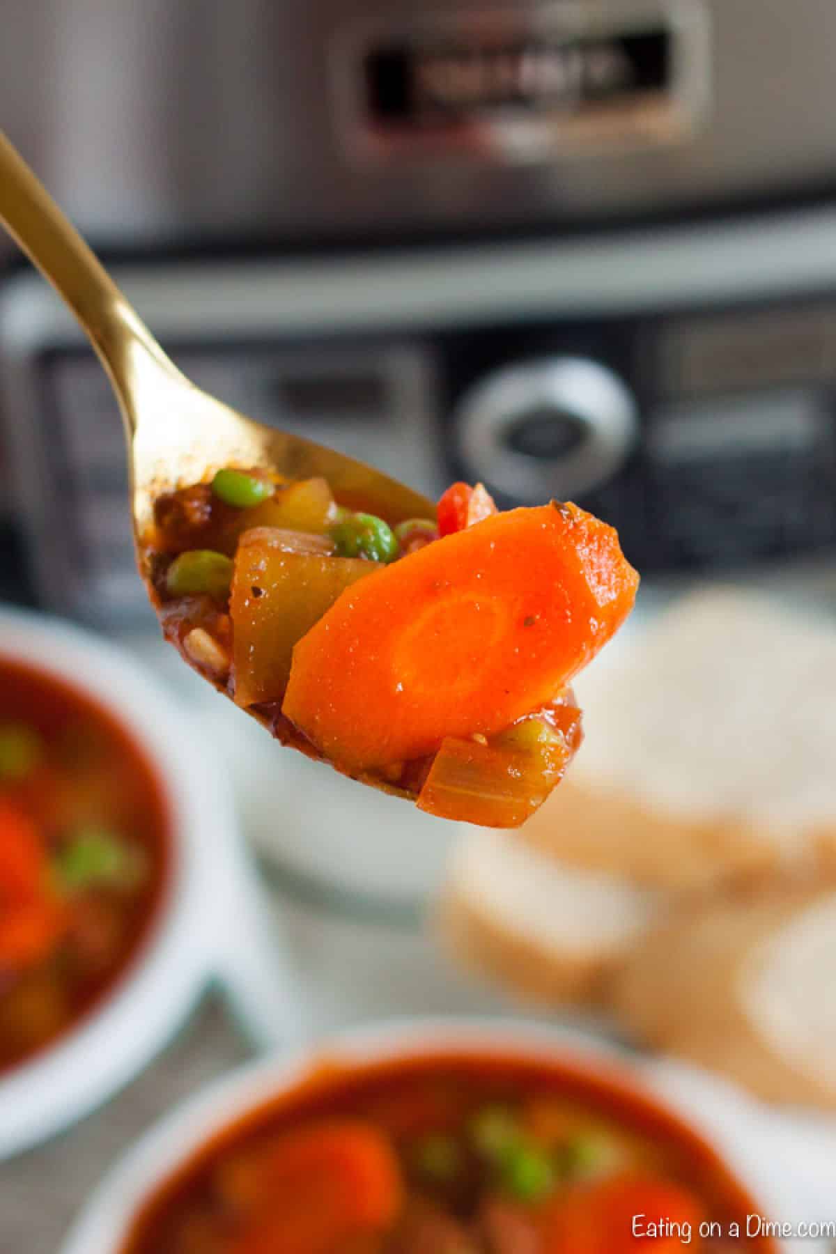 A bite of ground beef stew on a spoon