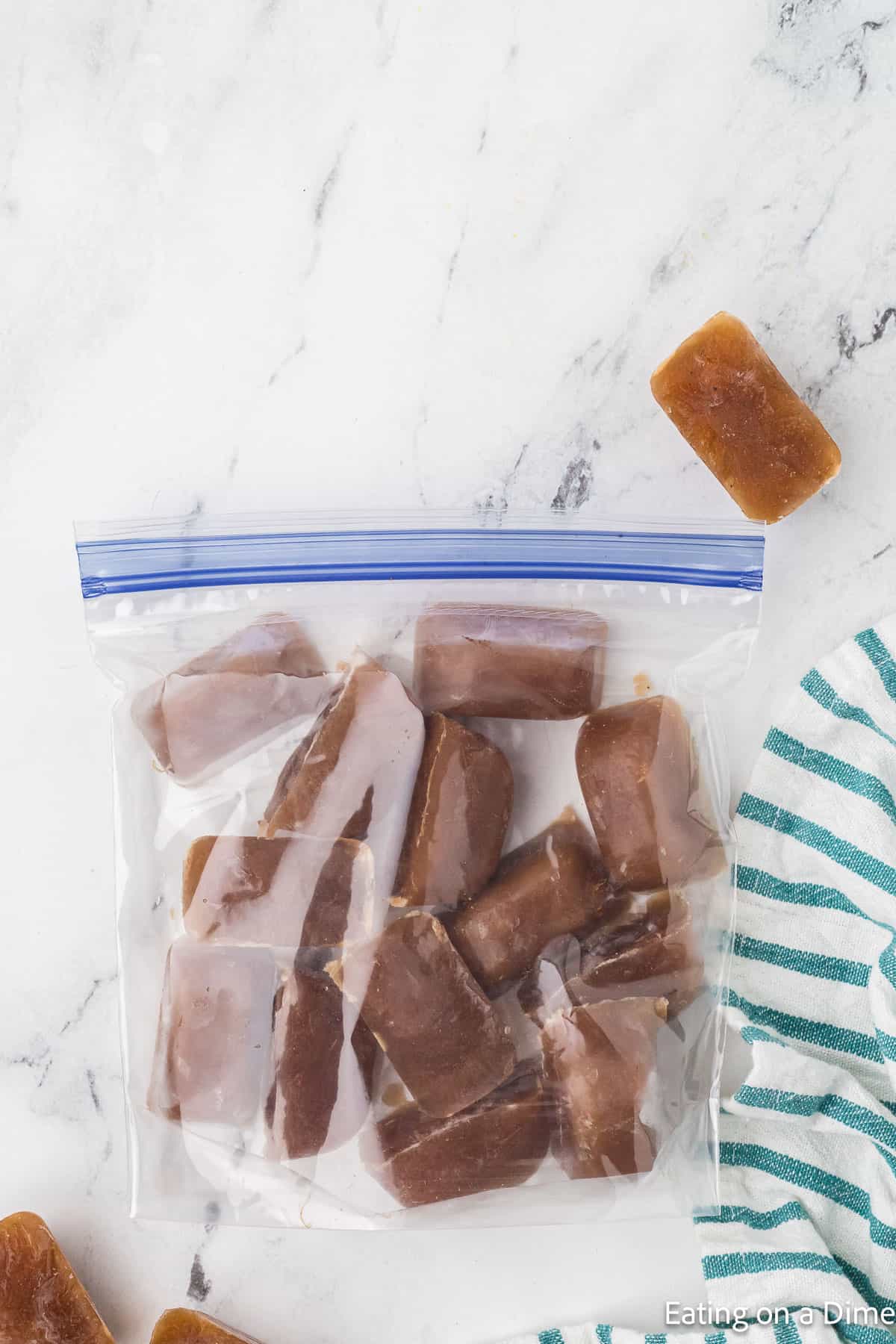 Frozen ice cubes of gravy in a zip lock bag