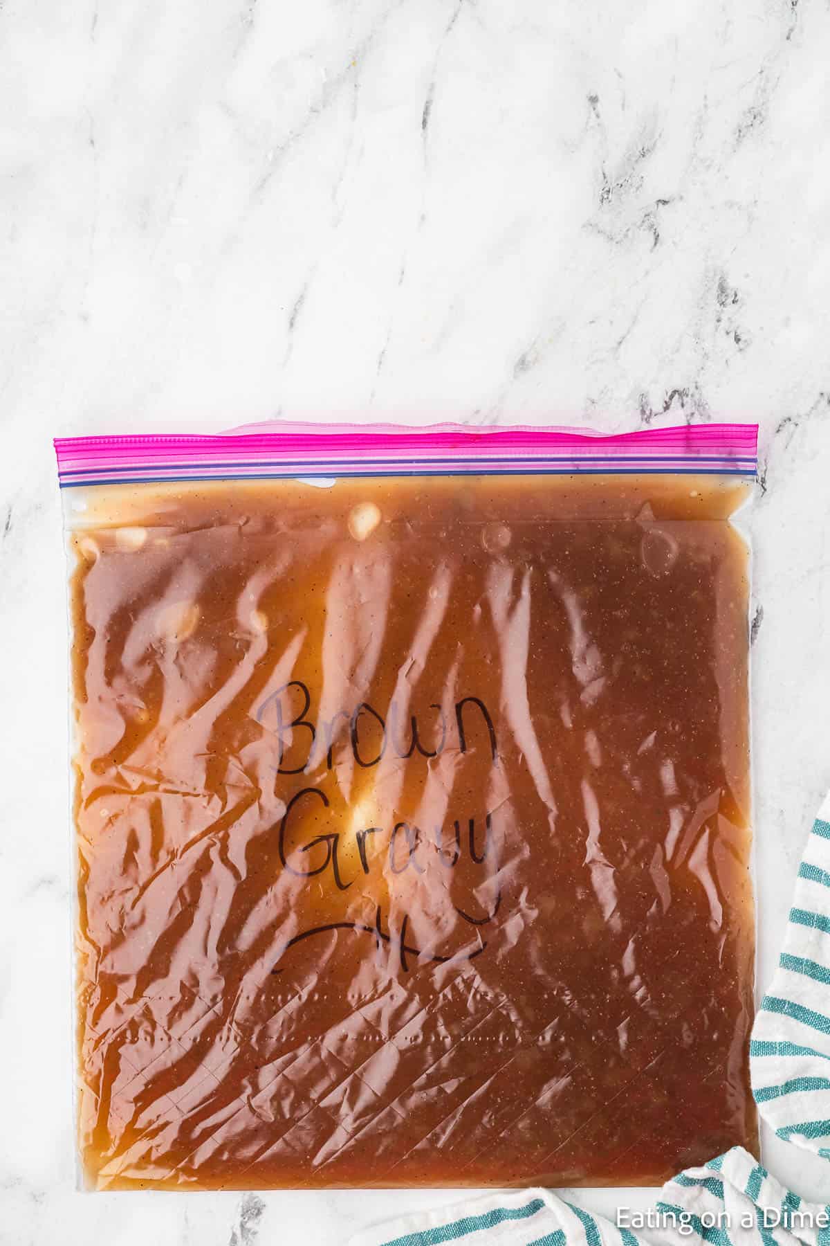 Zip lock bag full of brown gravy