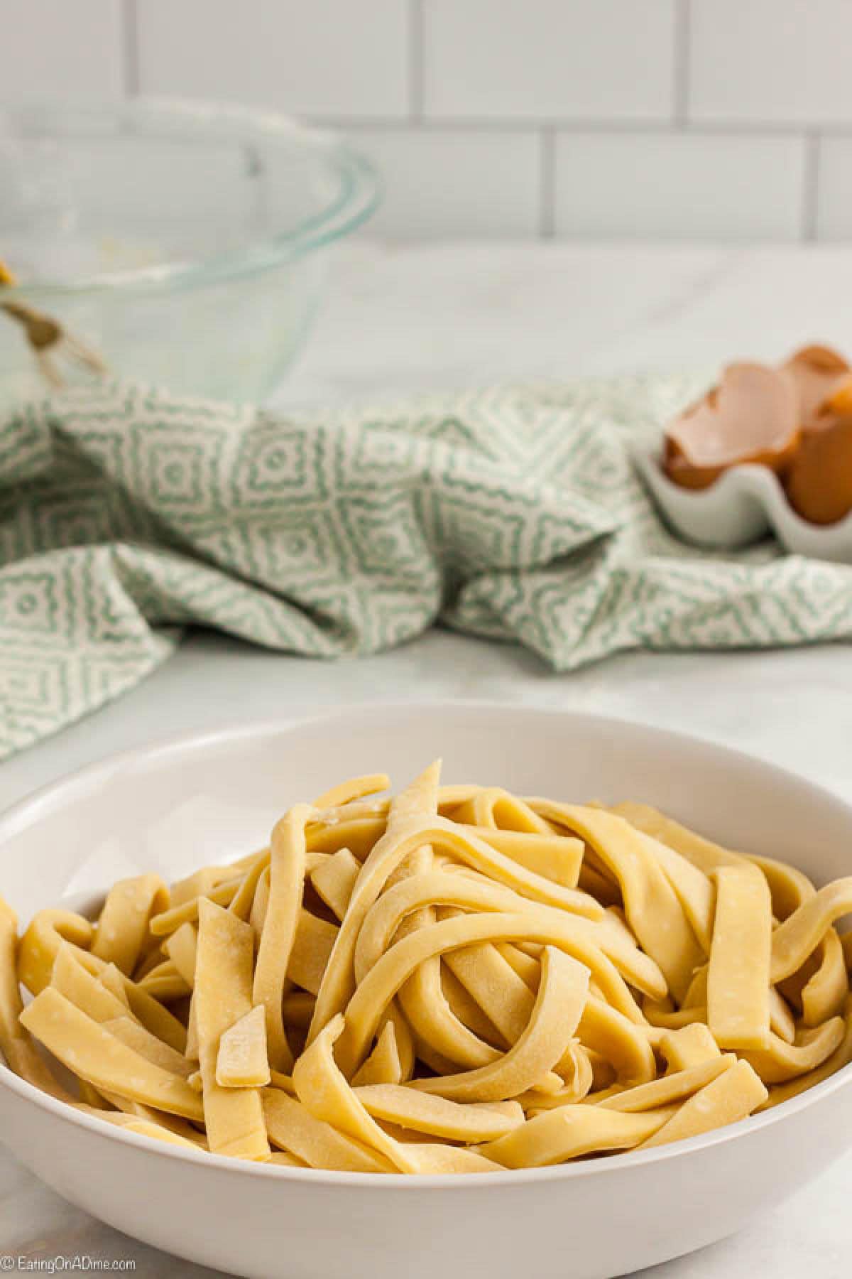 Uncooked egg noodles in a bowl