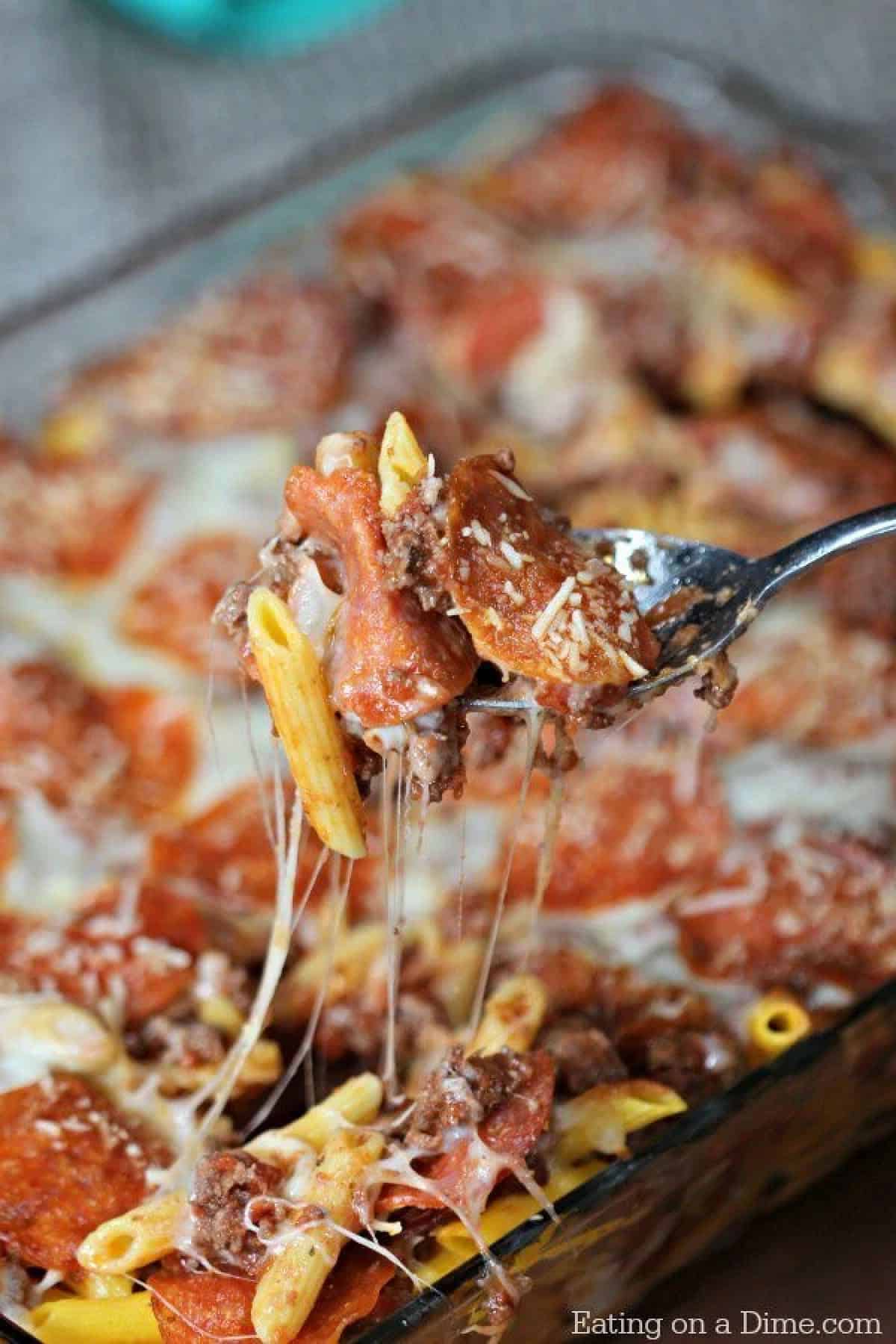 This easy pizza casserole recipe is a family pleaser! An Easy casserole recipe. Plus this pizza pasta casserole is an easy freezer meal. Try it today! 