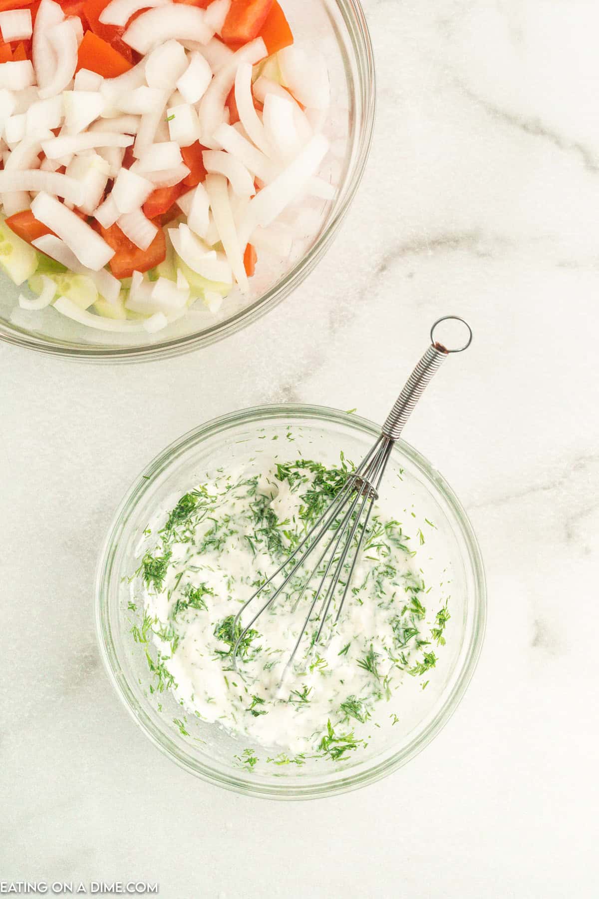 Combine sour cream, fresh dill, vinegar, sugar, salt, and garlic powder in a bowl with a whisk