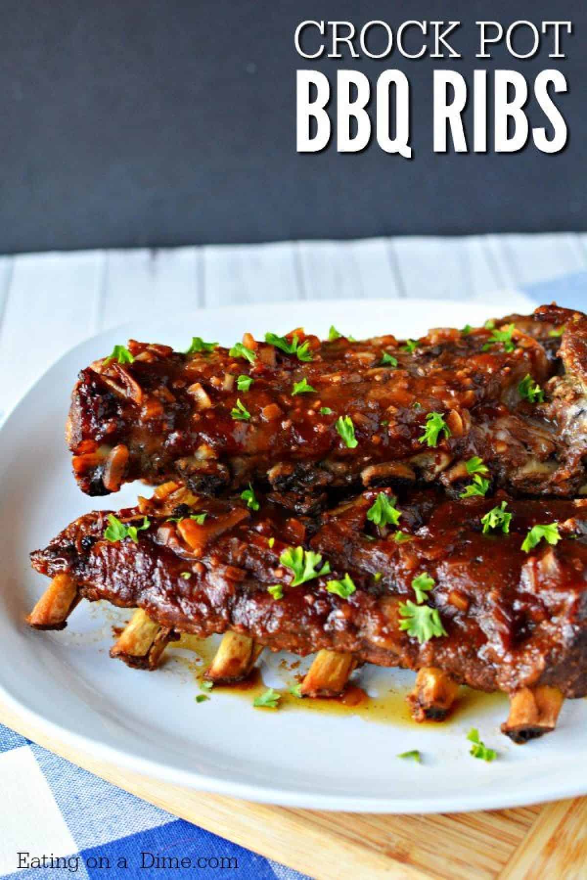 This slow cooker pork ribs recipe is easy to make and are fall off the bone tender! You'll never make ribs in the oven again once you make crock pot ribs! This is the best rib recipe ever! #eatingonadime #crockpotrecipes #dinnerrecipes 