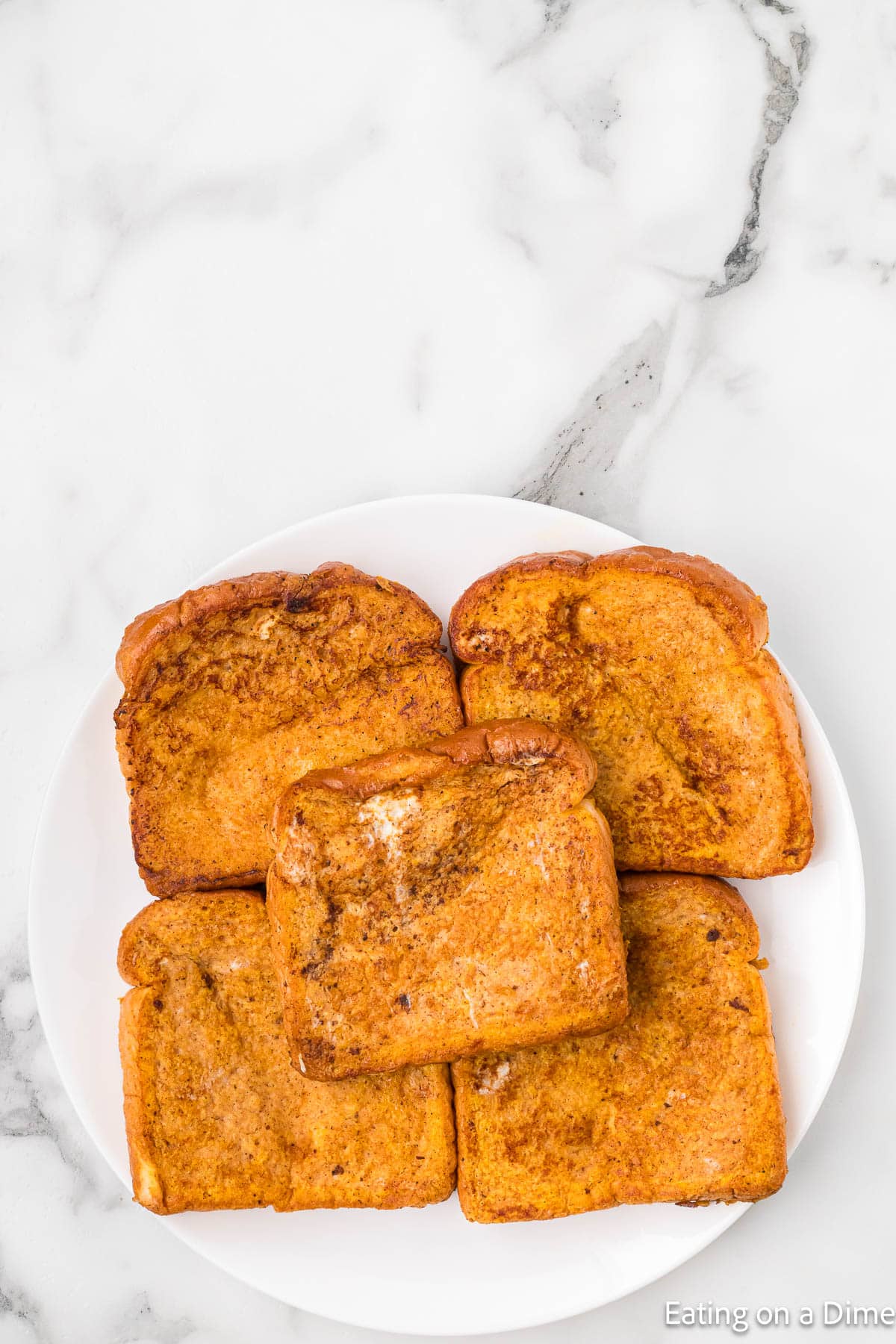 Pumpkin French Bread stacked on a plate