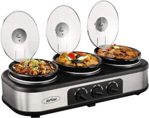 A triple slow cooker buffet server with three individual ceramic pots filled with different dishes. Each pot has a transparent lid and an independent temperature control dial labeled Low, High, and Warm. The unit has a metallic finish, prominently featuring the brand name "Sunvivi", known for the best slow cookers.