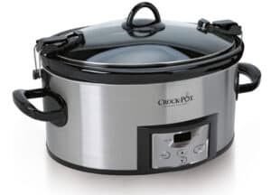 A stainless steel Crock-Pot slow cooker with a black plastic lid and side handles. The slow cooker features a control panel with buttons for adjusting settings and a small display screen. This model ranks among the best Crock-Pots available, offering reliability and convenience for any kitchen.