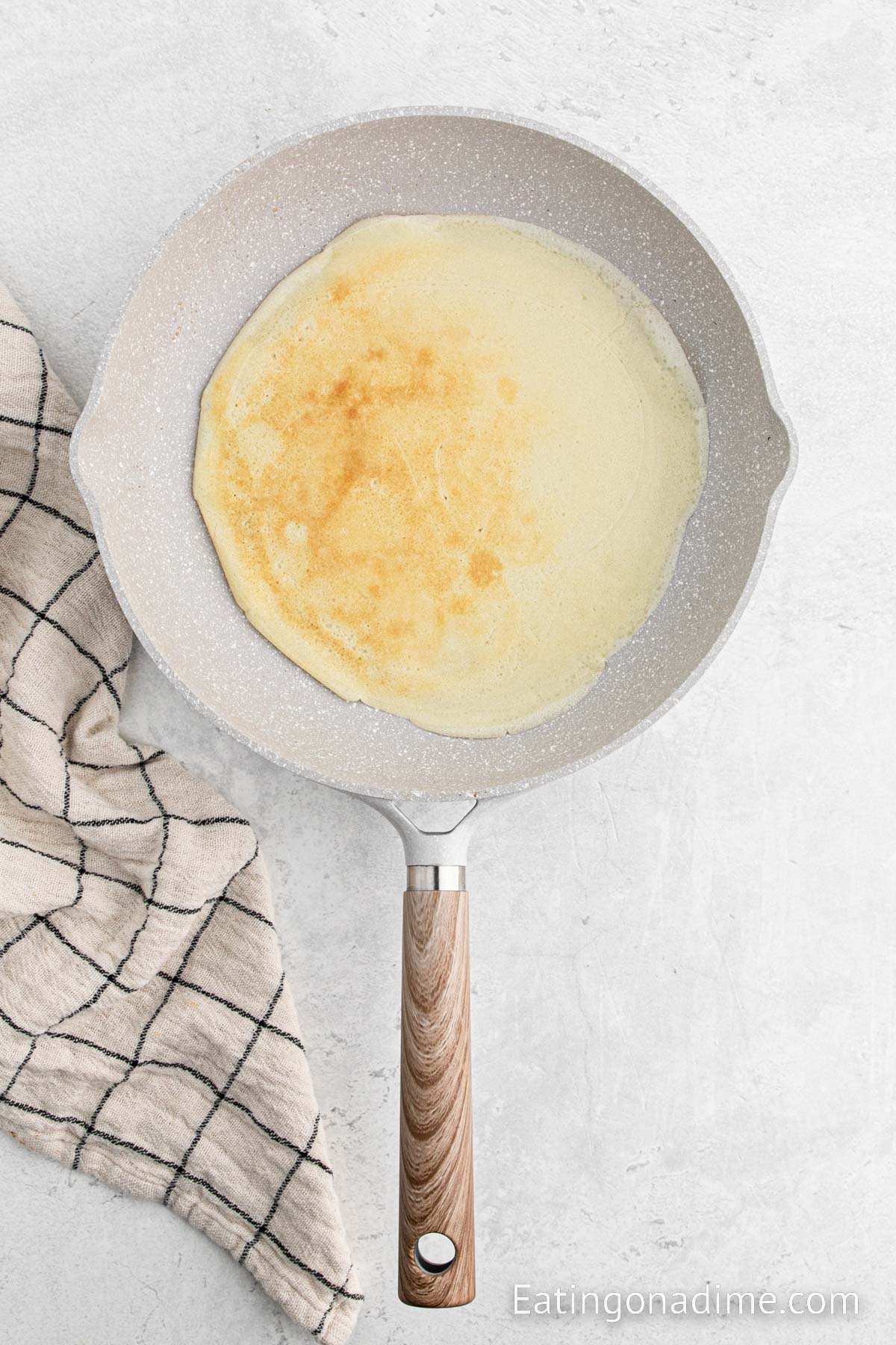 Golden brown crepe in a skillet