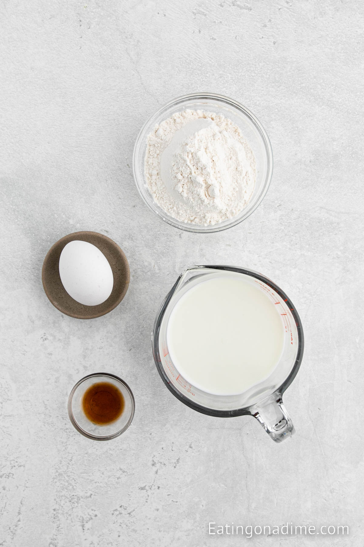 Pancake Mix in a bowl, egg, vanilla and milk