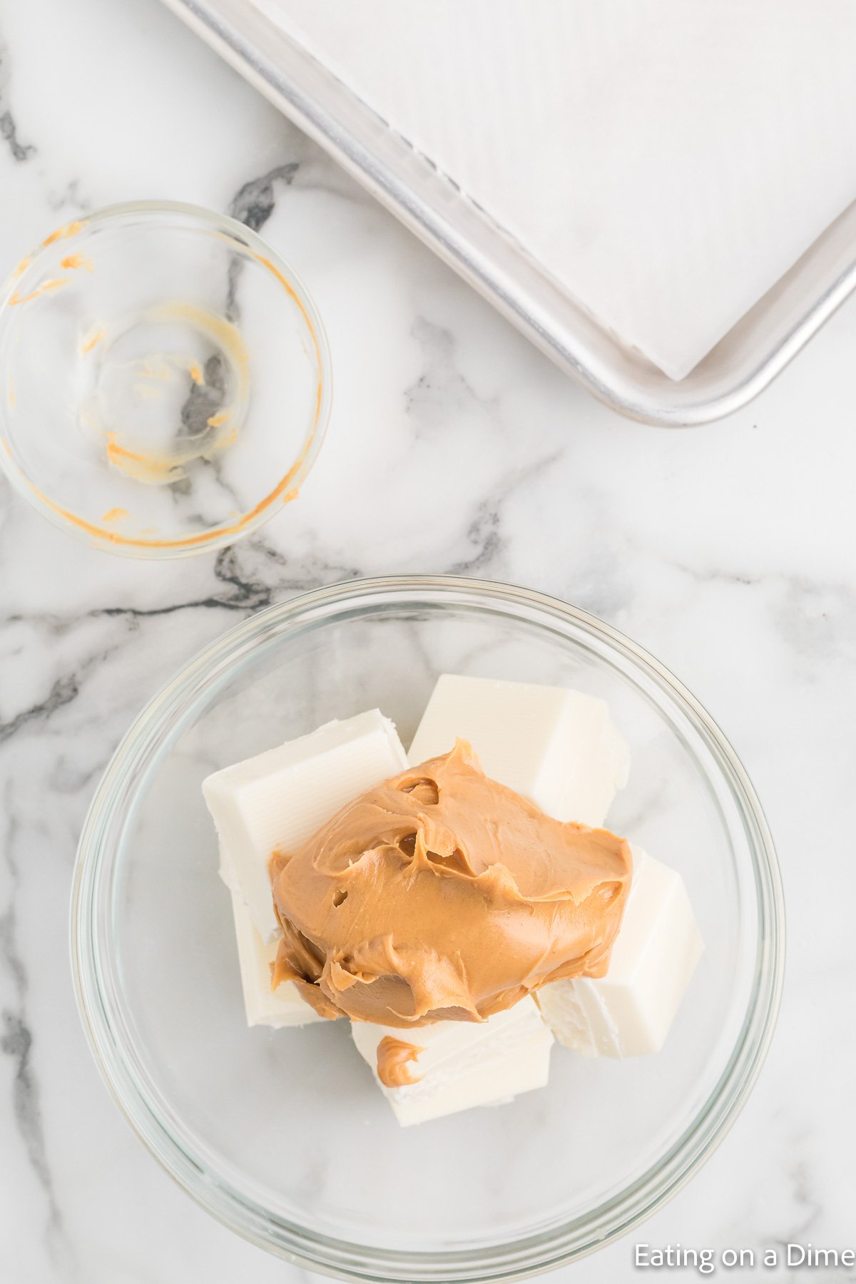 White chocolate bark in a bowl with creamy peanut butter