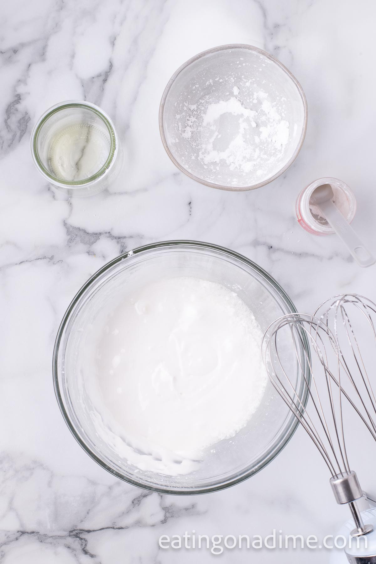 Mixing the icing in a bowl with a hand mixer