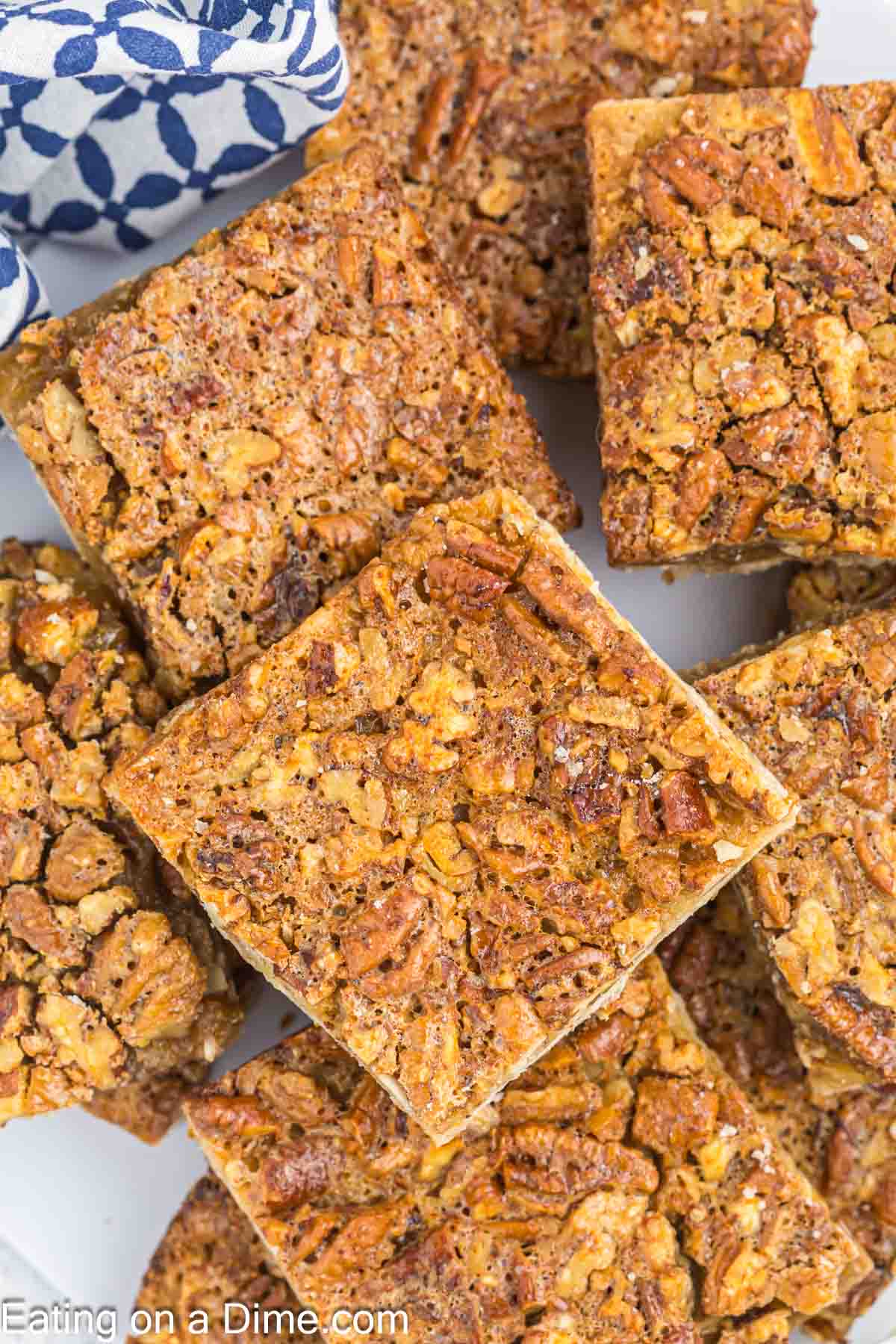 Pecan pie bars stacked on a platter