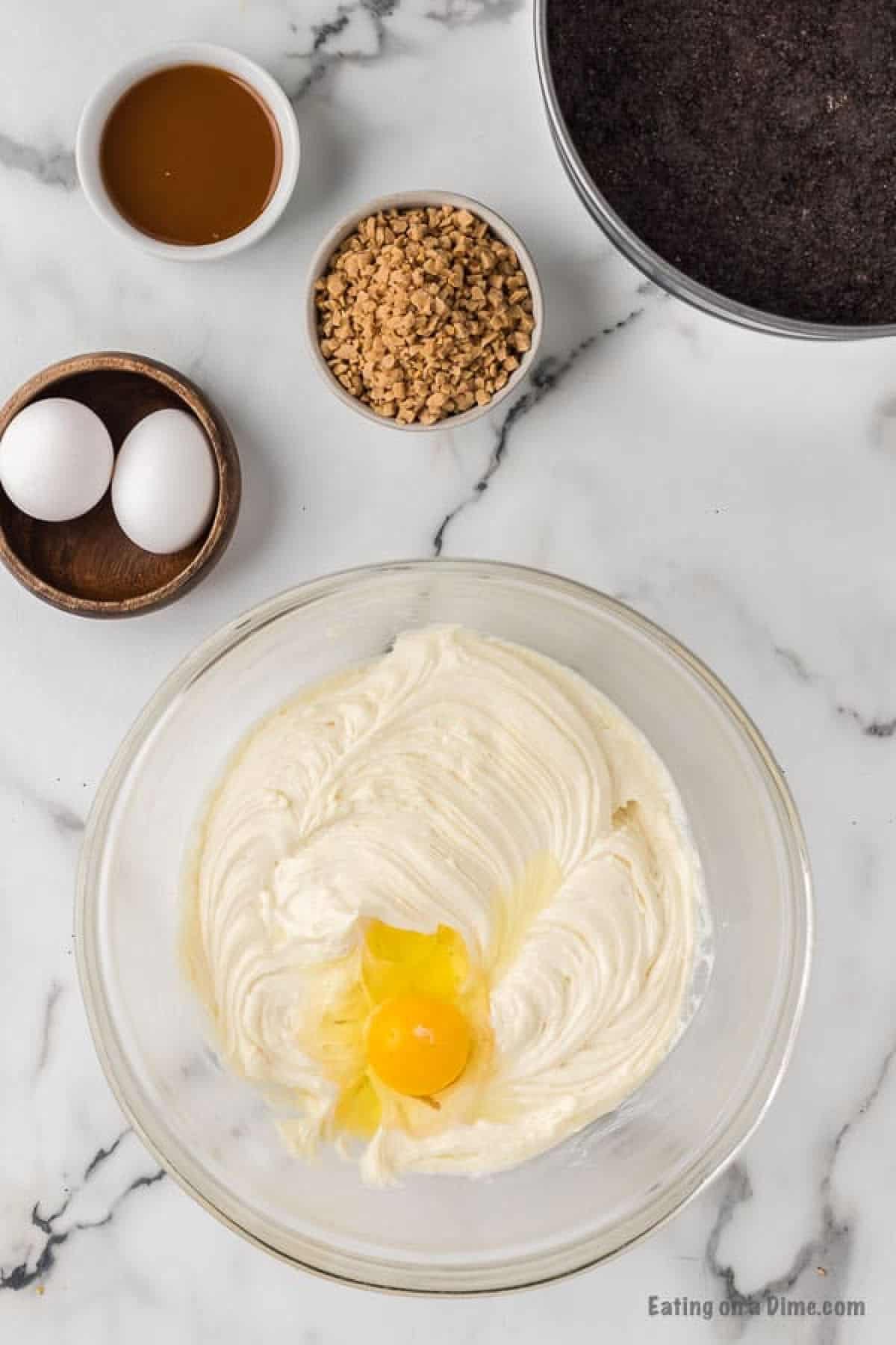 Beating the cream cheese, vanilla and sugar in a bowl