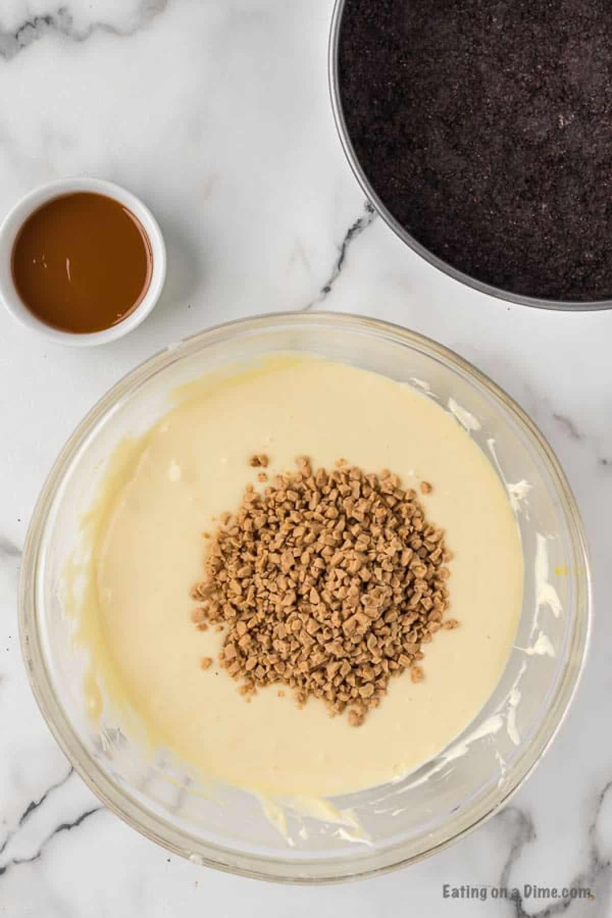 Stirring in the toffee bits in the cream cheese mixture