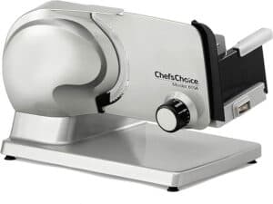 An electric food slicer with a metallic finish and adjustable thickness dial, the ChefsChoice Model 615A is touted among the best meat slicers. It features a sharp circular blade and a slide for holding food, ensuring precision in every slice.