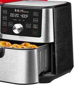 A stainless steel air fryer with a digital display reads 20 minutes at 400°F, showcasing why it's among the best stainless steel air fryers. The drawer is open, revealing crispy golden-brown fries. The control panel offers modes like air fry, roast, bake, and dehydrate.